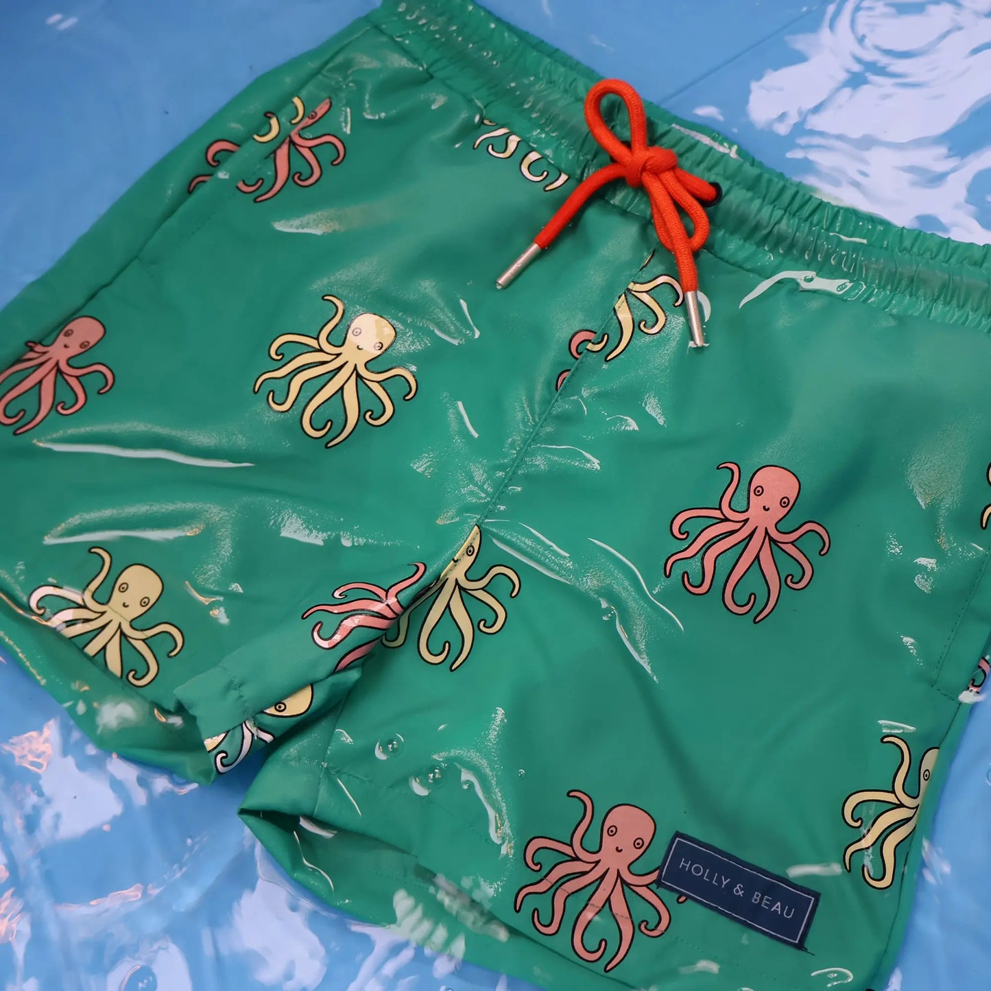 holly and beau color changing swim trunks in the water