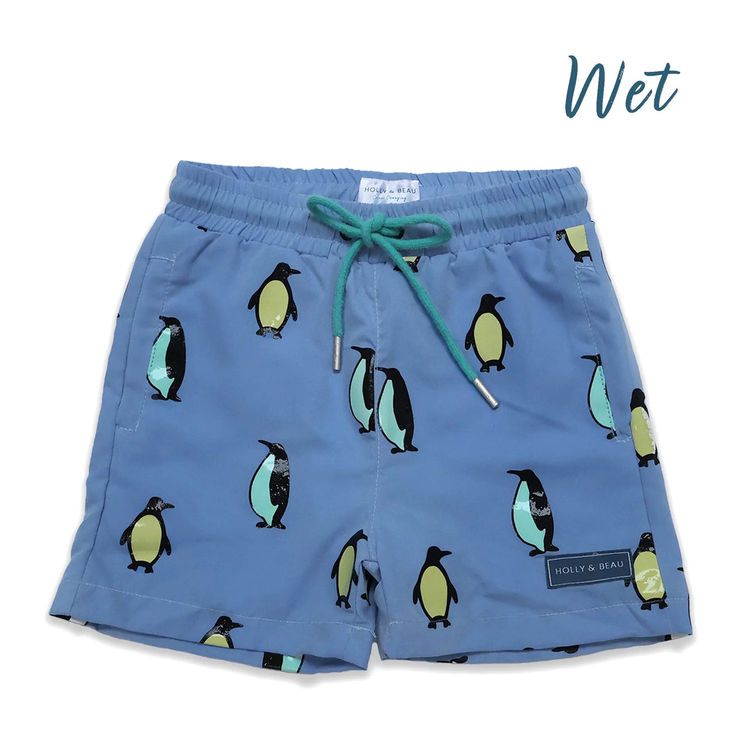Holly and Beau light blue penguin boys color changing swim trunks. Wet front view