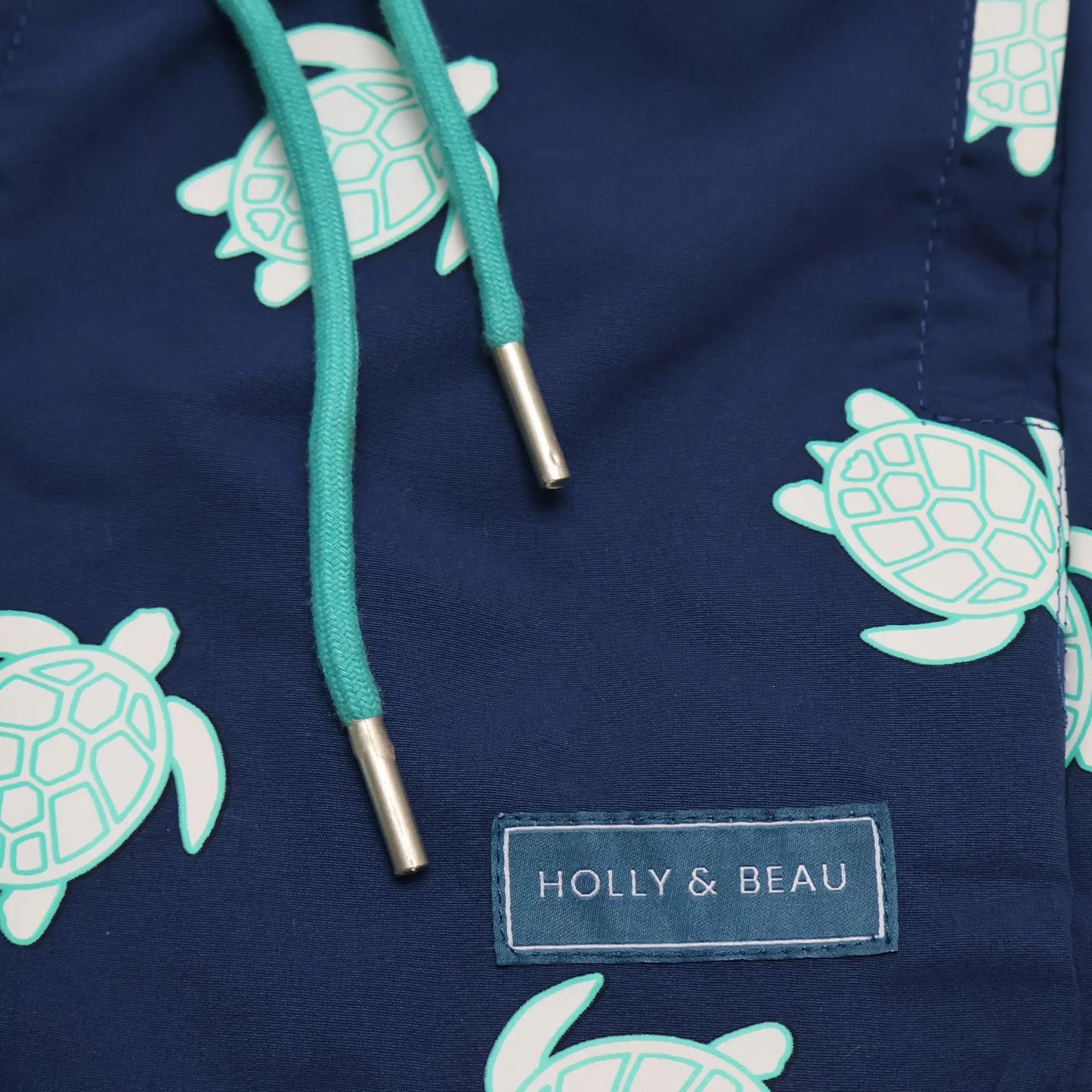 Turtle design drawstring and logo detail color changing boys swim trunks by Holly and Beau