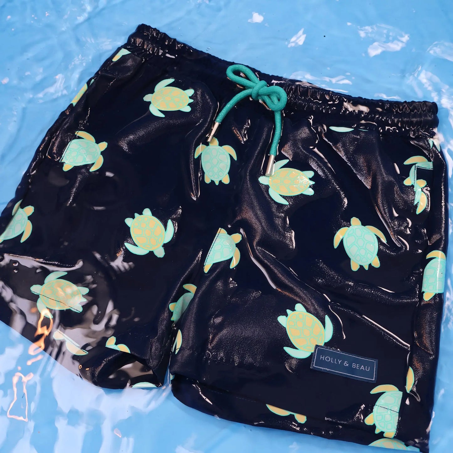 Turtle design in the water, color changing boys swim trunks by Holly and Beau