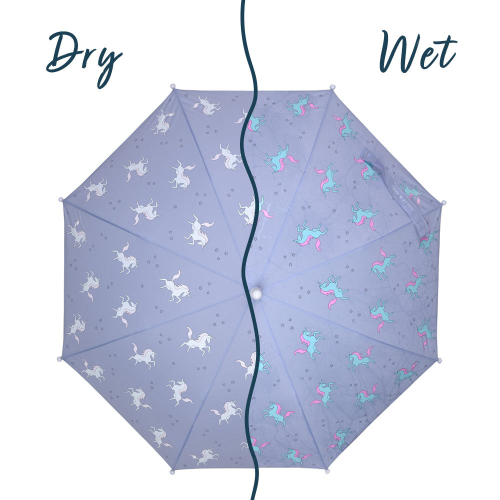 Kids purple unicorn color changing umbrella by Holly and Beau. Above view of the kids color changing umbrella with a wet/dry comparison. Stick kids color changing umbrella.