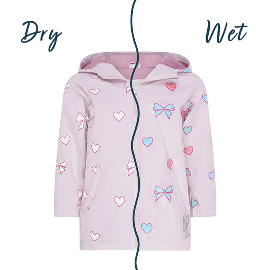 Wet and dry view of the pink bows and hearts color changing raincoat by Holly and Beau