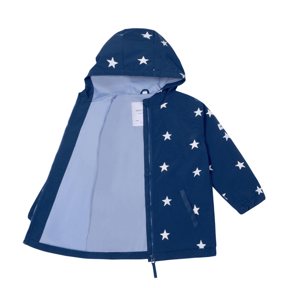 Blue star design kids color changing raincoat by Holly and Beau. Front view of the dry and inside lining of the kids color changing raincoat