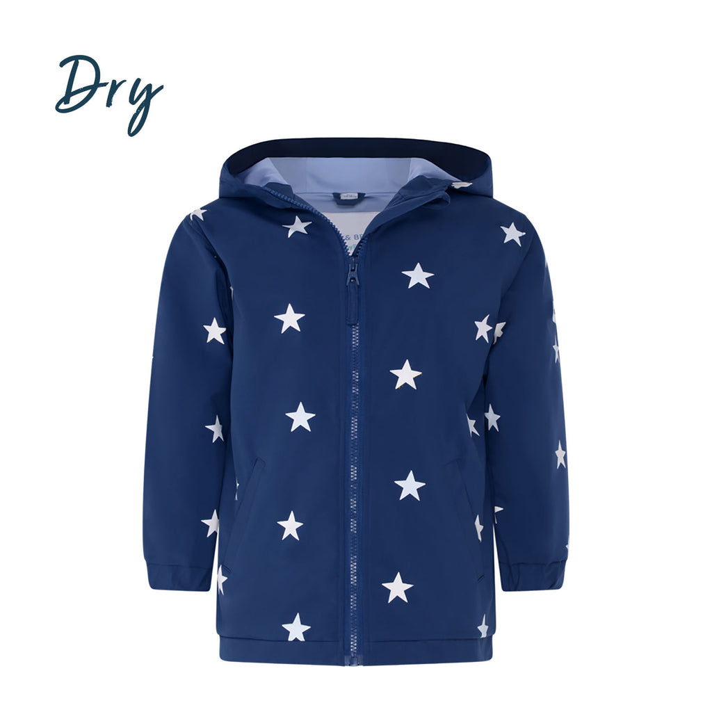 Blue star design kids color changing raincoat by Holly and Beau. Front view of the dry kids color changing raincoat