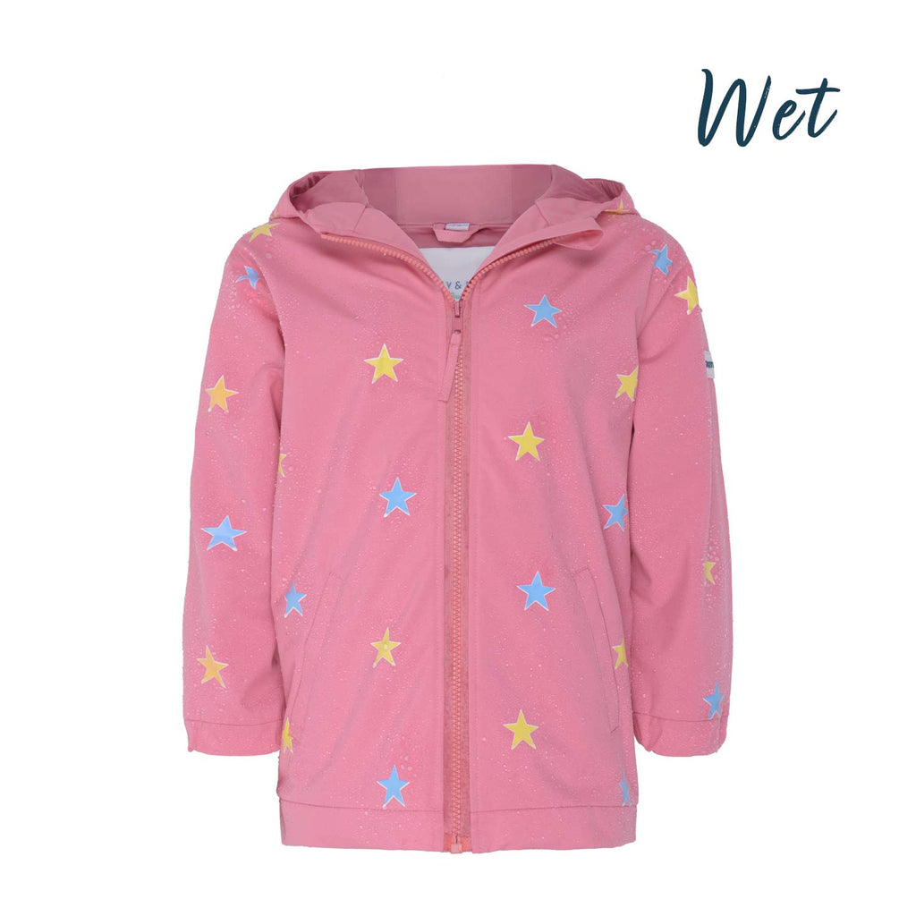 Kids color changing pink star raincoat by Holly and Beau. Front view of the wet color changing raincoat.