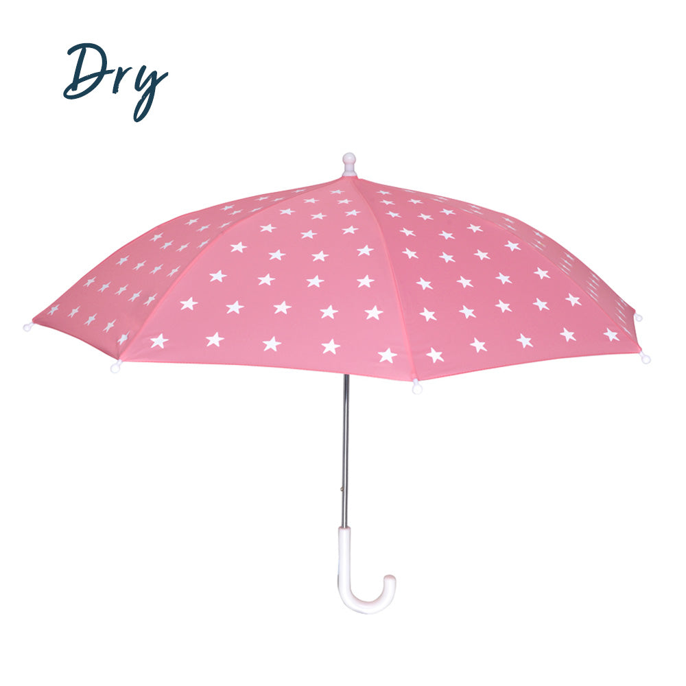 kids pink star color changing umbrella by Holly and Beau. Side view of the umbrella with a dry view before the color change. Stick kids color changing umbrella.